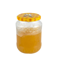 a glass jar containing honey