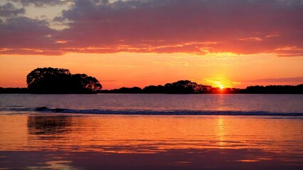 Fototapeta na wymiar Stunning sunset on the lake, purple sky.