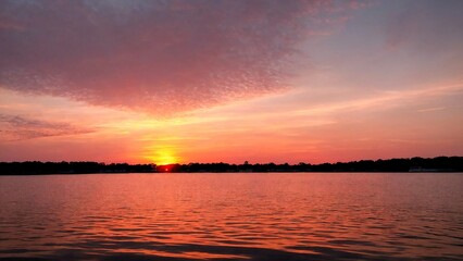 Stunning sunset on the lake, purple sky.