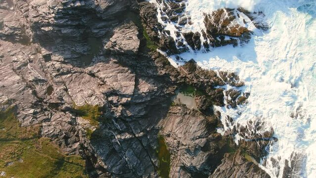 Top-down view of cliffs of Malin Head Coastal Walk, path west from Banba's Crown, Malin Head, Wild Atlantic Way, spectacular coastal route. Wonders of nature. Numerous Discovery Points. Co. Donegal