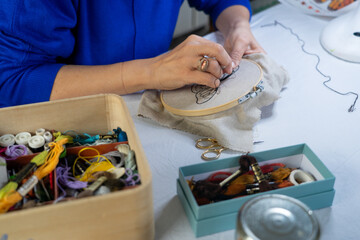 Woman Hand Embroidering with All Embroidery Accessories