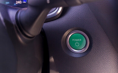 Start button of a hybrid or electric car. Eco driving concept