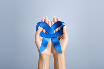 Hands Forming Heart with Blue Ribbon: Stand Against School Bullying