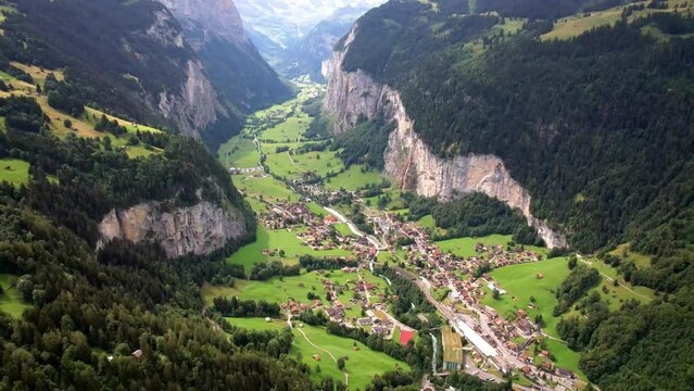 Switzerland nature and travel. Alpine scenery. Scenic traditional mountain villages Wengen and Lauterbrunnen  surrounded by Alps. Popular tourist destination in canton Berne. Aerial drone view 