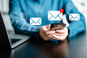 Businesswomen checking email via smartphone have spam malware screen alerts, cyber internet web...
