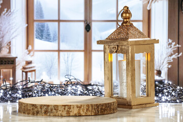 Desk of free space and golden retro christmas lamp. Winter window background and cold ecember day. 