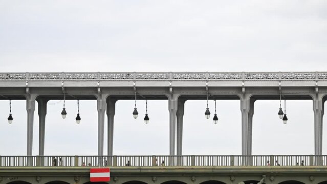 Paris, France - July 9, 2023 : The parisian urban subway (MP89 or MP 89 metro, metropolitain) passes over a bridge (pont de Bir-Hakeim, Passy line 6) in the French capital, Paris, France