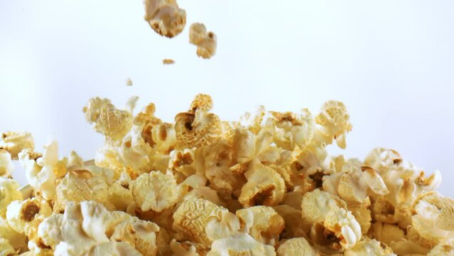 4k high speed video of popcorn falling and piling up