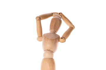A wooden mannequin is seen holding its head in its hands. This image can be used to depict stress, frustration, or a mental health concept.