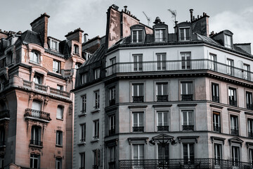 Fototapeta na wymiar Paris architecture, duel-toned filter. Traditional Haussmann style of the 19th century. Haussmann renovated much of Paris at the request of Emperor Napoleon III.