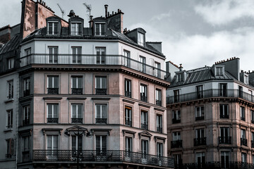 Paris architecture, duel-toned filter. Traditional Haussmann style of the 19th century. Haussmann renovated much of Paris at the request of Emperor Napoleon III. - obrazy, fototapety, plakaty
