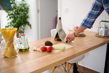 Obraz na płótnie Canvas Healthy organic raw vegetables for salad on the table near an oilcan with fresh extra virgin oil on the kitchen table