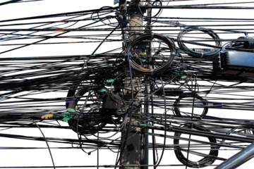 The wires on the electric pole are tangled.