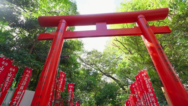 Tokyo, Japan, October 10, 2023 : The Row of Gates Torii path in Hie Shinto shrine in Minato, Tokto, Japan. Japanese traditional Hie Shrine temple. Torii gates