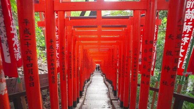 Tokyo, Japan, October 10, 2023 : The Row of Gates Torii path in Hie Shinto shrine in Minato, Tokto, Japan. Japanese traditional Hie Shrine temple. Torii gates