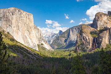 Yosemite National Park panoramic valley summer landscape in the Sierra Nevada Mountains of California, USA.