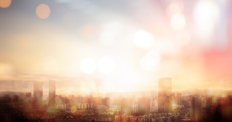 City blur background of blurry morning light on sky with bokeh and sun flare  city night life summer travel holiday vacation