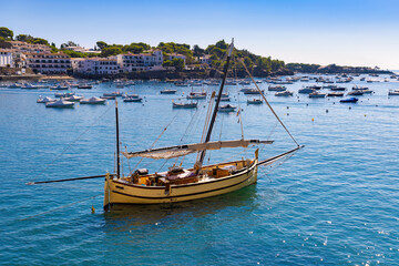 Fototapeta na wymiar Sailboat anchored in the bay of Cadaqués, Alt Empordà, Costa Brava, Catalunya, Spain