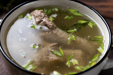 Boiled fatty broth in a plate