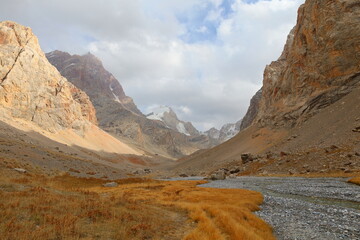 Fototapeta premium Chimtarga mountain pass landscape - highest peak of Fann mountains located between Mutnyi lake and Bolshoi Alo lake, Tajikistan