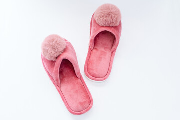 Cute home pink fluffy slippers on white background