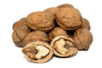 Closeup of whole and halved walnuts isolated on white background