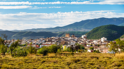Panoramic view of the Andalusian white village next to the high mountains that surround it, Velez Rubio, Almeria.