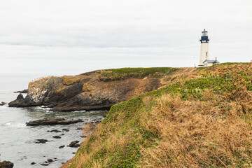 Fototapeta na wymiar Yaquina Head Lighthouse seascape on the central Oregon Pacific coast.