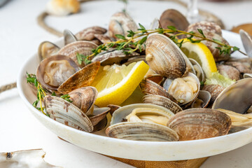 Vongole prepared with lemon and herbs close-up