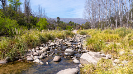 calm narrow creek of crystal mountain water in Nono, Cordoba. Taken on a warm spring afternoon