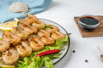 Shrimp skewers, fried shrimp with spices close-up