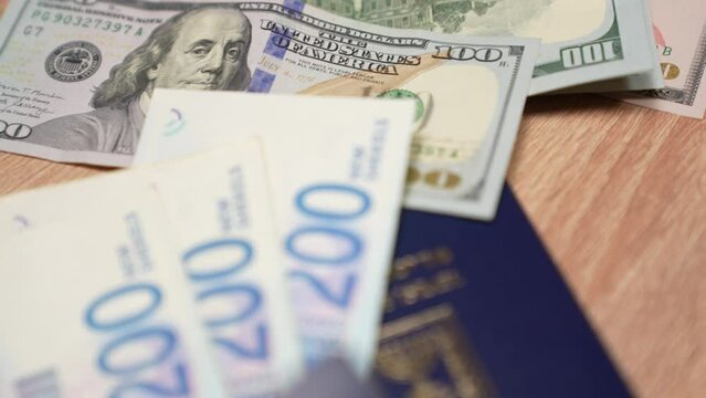 Israeli passport and shekels. Travel passport and dollars. Slow motion. concept: buying tickets from Israel to the USA, travel. Preparing for the trip.