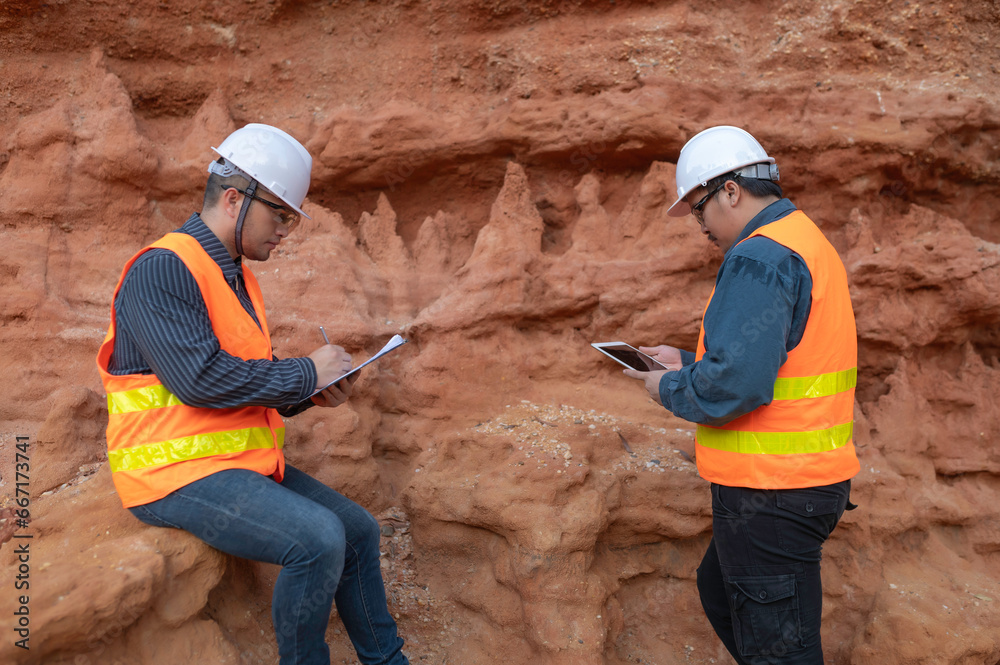 Wall mural Geologist surveying mine,Explorers collect soil samples to look for minerals. - Wall murals