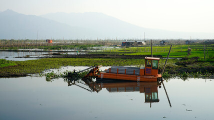 Harvester for cleaning water hyacinth or weed at Rawa Pening lake, Indonesia