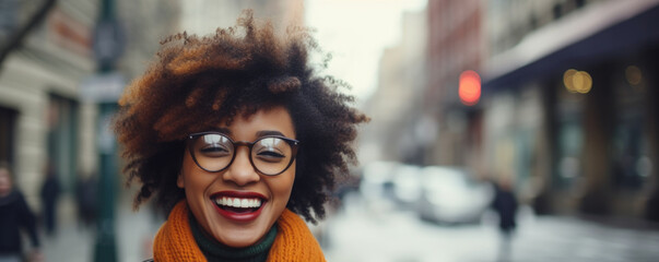 Portrait of happy young woman wearing glasses outdoors