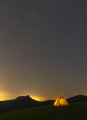 Fototapeta na wymiar Tent and night with stars in the Aiako Harriak Natural Park, Euskadi