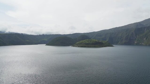 Laguna de Cuicocha close to Otavalo, beautiful blue lagoon with islands inside the crater of the Cotacachi volcano