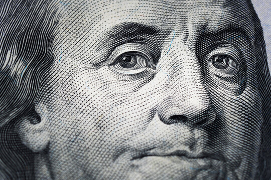 Closeup portrait Benjamin Franklin on 100 us dollar bill.