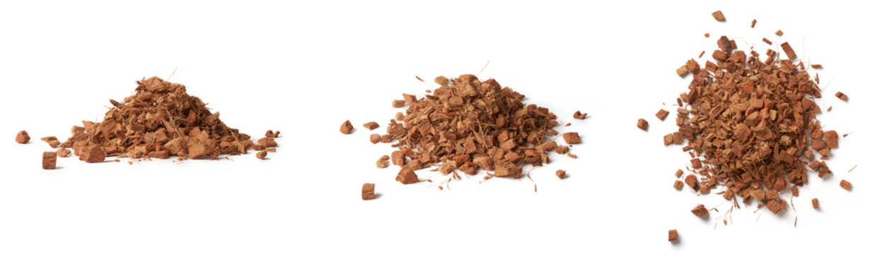 pile of coconut husk chips, popular horticultural and gardening product made from the outer husk of coconuts, sustainable and eco-friendly alternative to potting mixes and mulches, isolated on white 