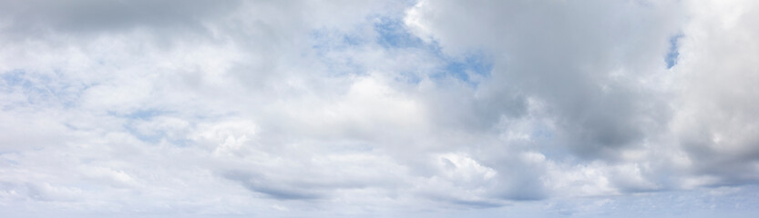 Panoramic grey sky with small blue sky patches - obrazy, fototapety, plakaty