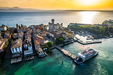 Naklejka premium old town and port of Sirmione in italy