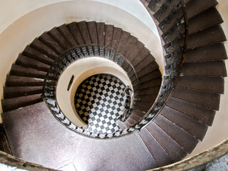 Fototapeta premium Spiral staircase in an old apartment house