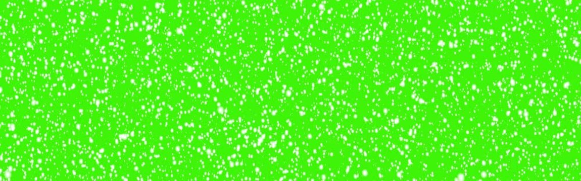 Snowflakes fly on a green background - Snow swirls and flies - Chroma key - New Year - Christmas