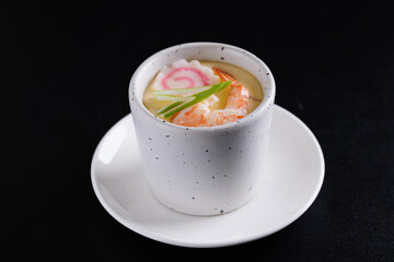 Japanese Traditional food Eggs Custard Chawanmushi isolated in black background