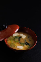 Miso soup traditional Japanese food with tofu isolated in black background