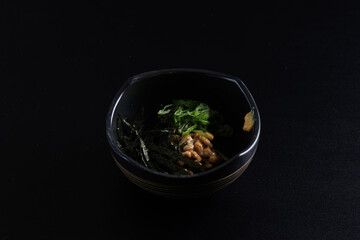 Natto japanese appetizer food isolated in black background