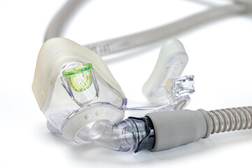 Respiratory mask for sleep disorders isolated over white. Apnea. Air pump. Assisted breathing.