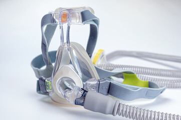 Continuous positive airway pressure- mask (CPAP) and hose isolated on white background - obrazy, fototapety, plakaty
