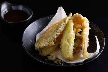 Mix tempura with shrimp fish and vegetable Japanese food isolated in black background