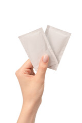 Fototapeta premium Wet wipe in a woman hand isolated on a white background.